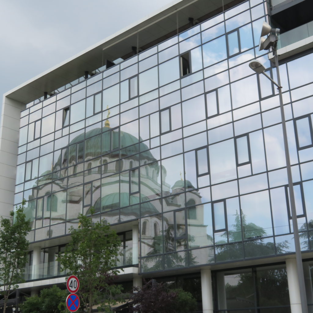 Reflection of Orthodox Cathedral on Nearby Building in Belgrade Serbia